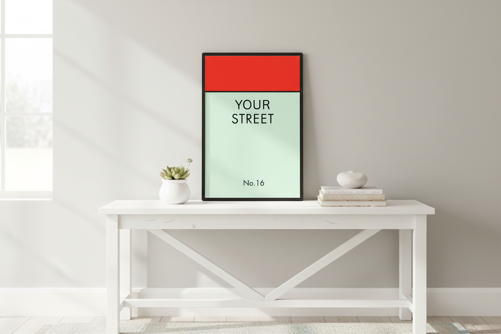 Personalized street sign print displayed on entryway console table